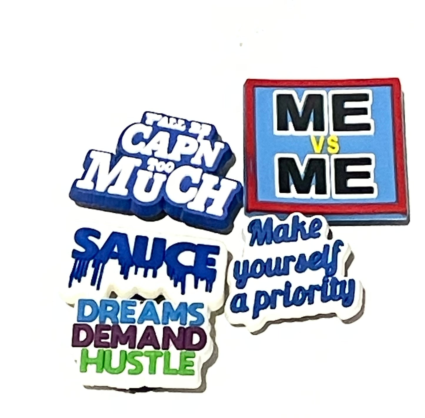 Colorful motivational phrase magnets on a white background