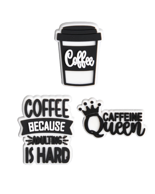 Three shoe charms with coffee-themed text and a crown graphic, designed for insertion into the holes of shoes.