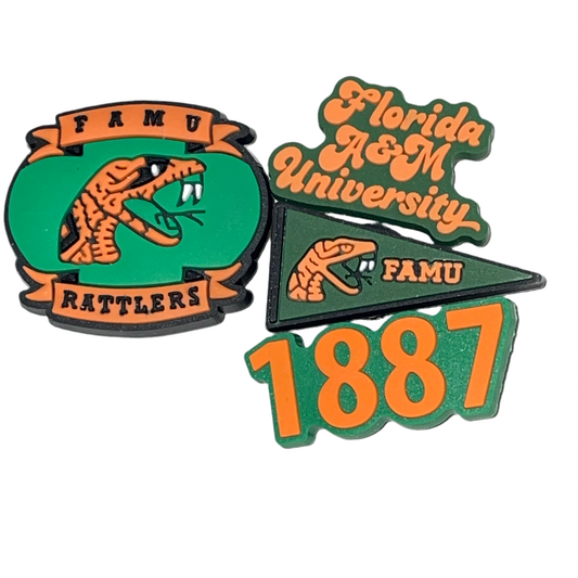 A collection of three shoe charms featuring the Florida A&M University colors and a rattler animal design.