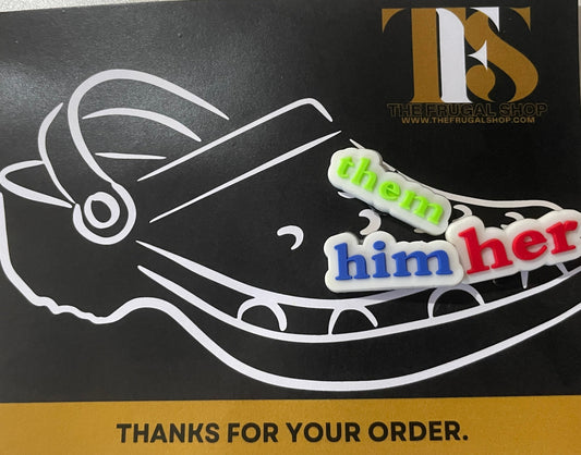 Sticker with a shoe design and 'them him her' text on a black background with gold border.