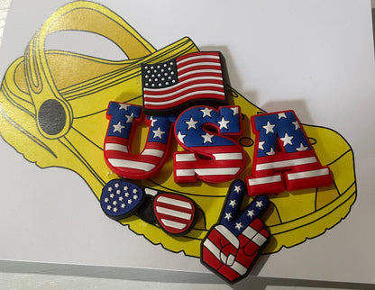 Shoe charms with American flag design on a branded card