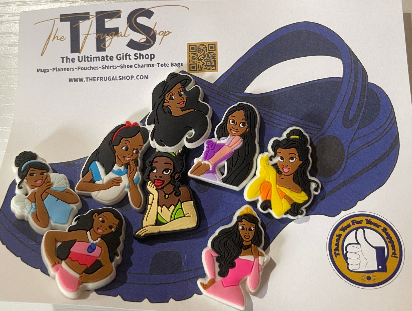 Set of figurines on a card with 'The Ultimate Gift Shop' branding