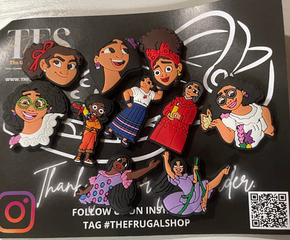 Set of colorful figurines on a black card with branding and QR code.
