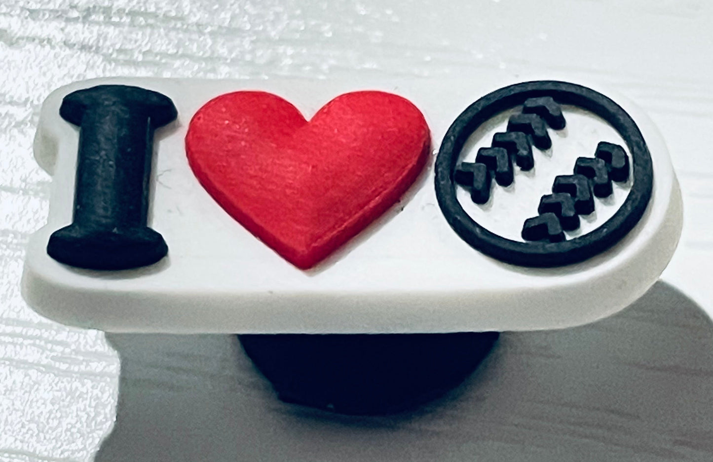 Phone grip with 'I ❤️ Baseball' text on a white background