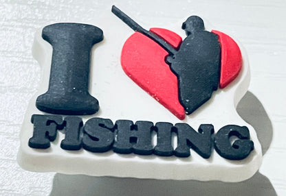 Fishing-themed cake with 'I ❤️ FISHING' text on a white background