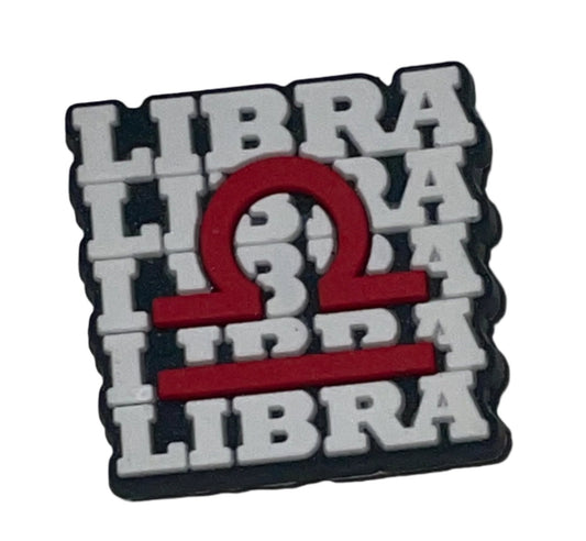 A shoe charm featuring the word 'LIBRA' alongside a symbol representing the zodiac sign Libra.