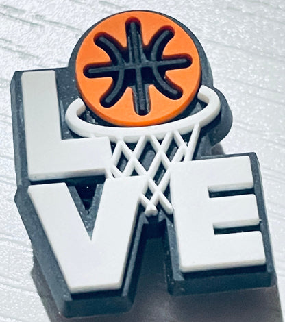 Basketball-themed decorative item with 'LOVE' letters on a textured white background