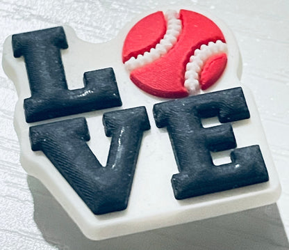 Decorative item with 'LOVE' letters and a red and white heart on a white background