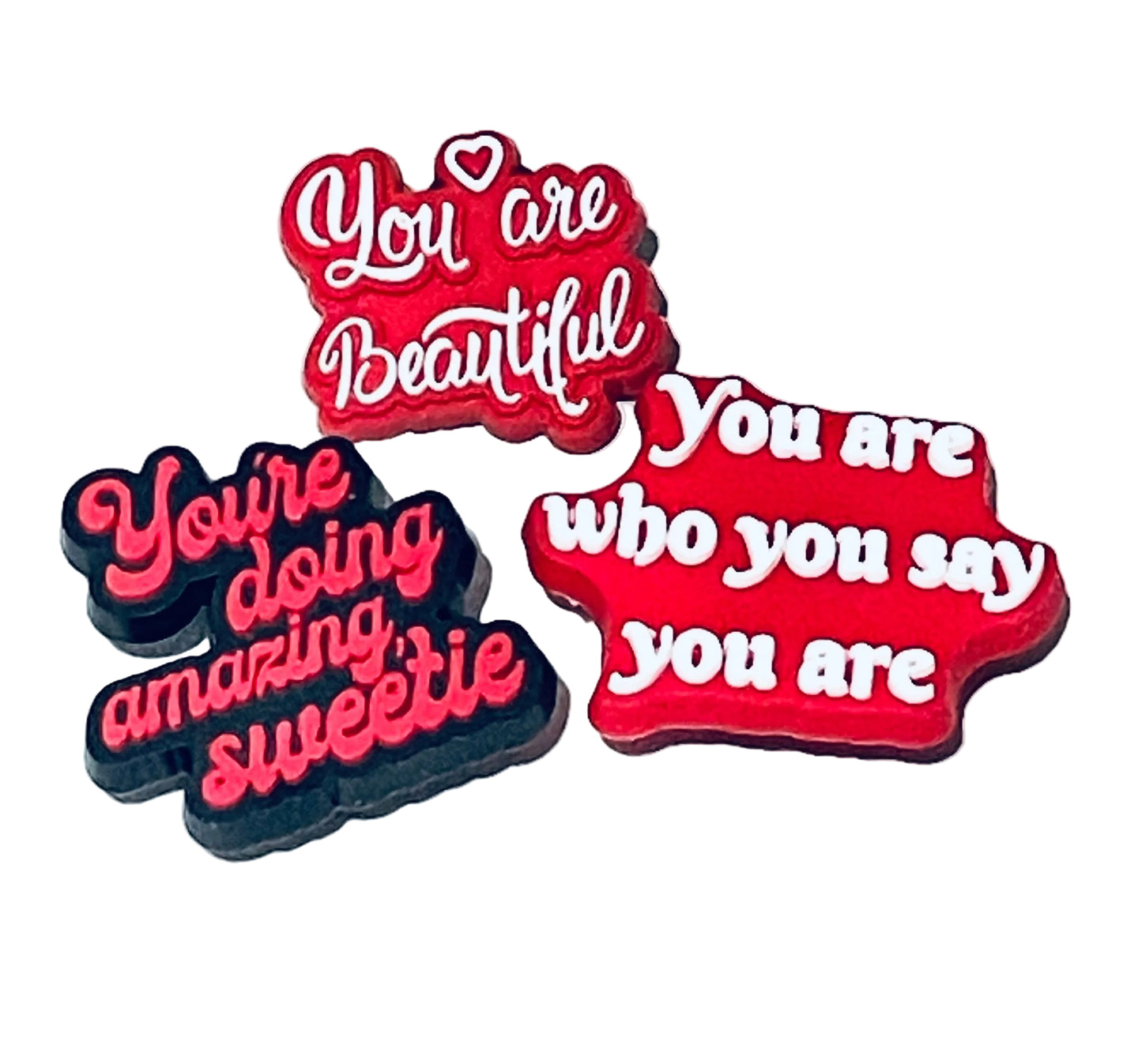 Three motivational stickers with phrases on a white background
