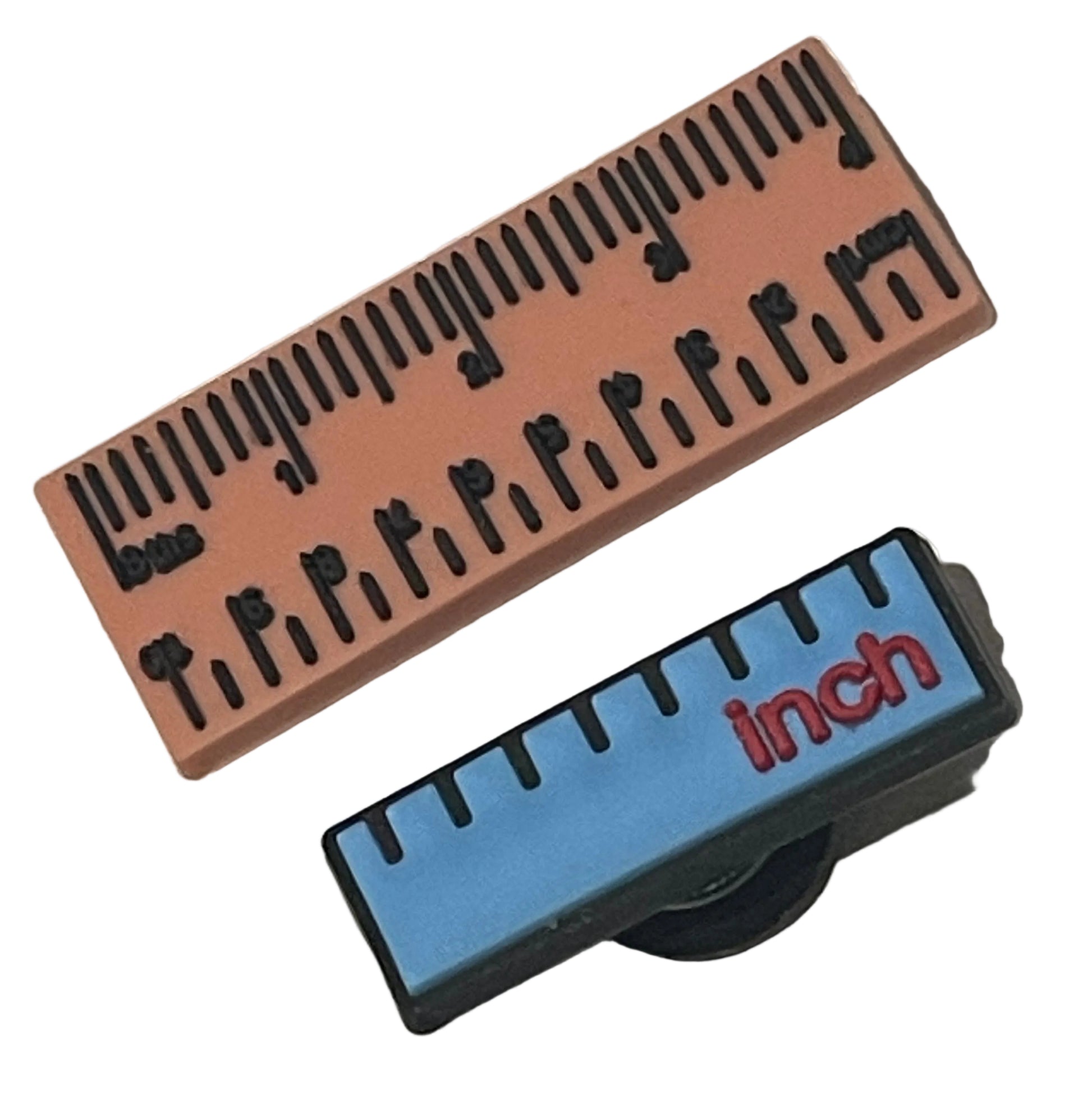 Two rulers, one brown and one blue with black markings, on a light gray background.